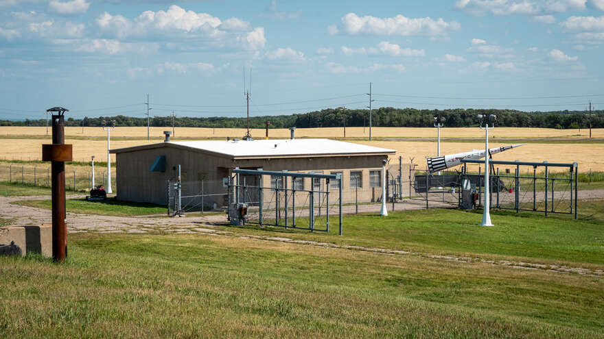 The RSL-3 guardhouse and entrance gate. A life-size model Sprint missile is in the background.